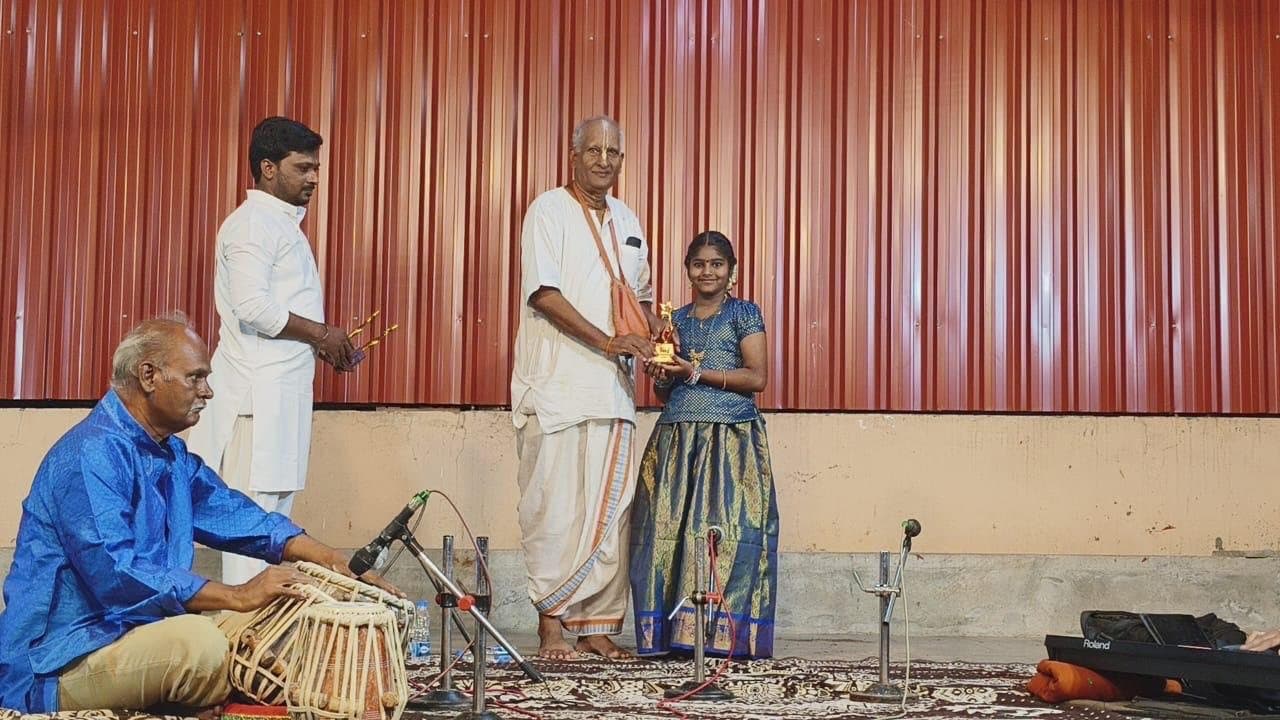 Students on stage with tabla